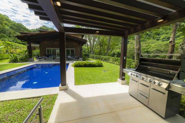 View of the rancho, the gas BBQ grill and patio at Casa Forest in Los Suenos